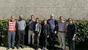 Arcamat - Copenhagen meeting 2025 Eight members of the Arcamat project from AGH University of Krakow, DBI, TU Freiberg, and DTU standing in front of the DTU building in Copenhagen during a project meeting in September 2025.